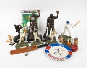 A collection remainder mainly consisting of cricket items, including two Bradman "The Final Salute" bronze-style statuettes, a signed cricket ball, several commemorative medallions and stamp products, posters, figurines, and much else besides. (qty.)