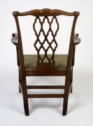 An antique Irish mahogany Chippendale armchair with finely carved scroll terminals to the arm rests, fretted back splat, cogwheel carving and shell decoration, 18th century, 100cm high, 68cm across the arms. - 3
