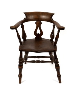 An antique English elm and beech smoker's bow chair, 19th century, 84cm high, 68cm across the arms.