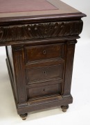 An antique French walnut twin pedestal desk with red leather insert top and Ionic carved pilasters, 19th century, 82cm high, 137cm wide, 86cm deep. - 3