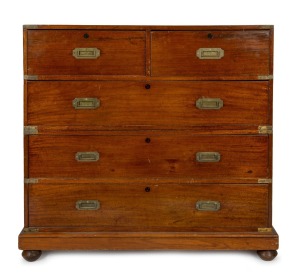 An antique Colonial Anglo-Indian teak two sectional military campaign chest with flush fitted brass hardware and ebony escutcheons, mid 19th century, 105cm high, 112cm wide, 51cm deep.