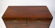 An antique Colonial Anglo-Indian teak two sectional military campaign chest with flush fitted brass hardware and ebony escutcheons, mid 19th century, 105cm high, 112cm wide, 51cm deep. - 2