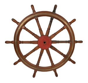 An antique ships wheel, teak and brass with remains of metal shaft, 19th century, an impressive 154cm wide.