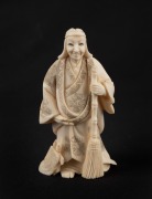 A Japanese carved ivory okimono of a man and turtle, early to mid 20th century, ​​​​​​​7.5cm high.