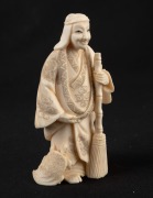 A Japanese carved ivory okimono of a man and turtle, early to mid 20th century, ​​​​​​​7.5cm high. - 2