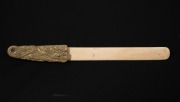 An antique Japanese carved whalebone page turner with gilt brass dragon handle, Meiji period, 19th century, ​​​​​​​28cm long. - 2