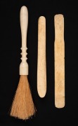 An antique whalebone busk, dress seam rubber and fly whisk, 19th/20th century, (3 items), ​​​​​​​the largest 29cm long.