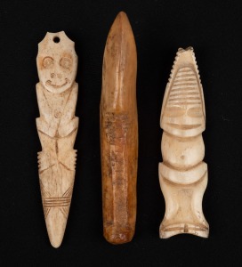An antique whalebone harpoon tip, together with two carved whalebone figural amulets, mixed vintages, (3 items), the largest 10cm long.