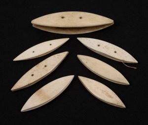 Seven assorted antique whalebone shuttles, 19th century, the largest 9.5cm long.