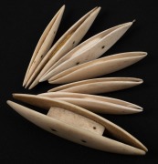 Seven assorted antique whalebone shuttles, 19th century, the largest 9.5cm long. - 2