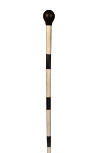 An antique walking stick with turned timber top and whalebone and baleen shaft, 19th century, ​​​​​​​94cm high.