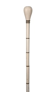 An antique whalebone and baleen walking stick with brass ferrule, 19th century, 86cm high.