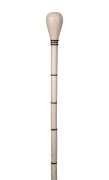 An antique whalebone and baleen walking stick with brass ferrule, 19th century, 86cm high.