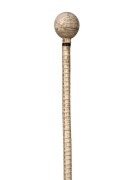 An antique shark vertebrae walking stick with scrimshaw whale's tooth top with tallship decoration engraved "L.F. 1842", 19th century, 85cm high.
