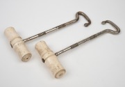 A pair of antique boot jacks with whalebone turned handles, 19th century, ​​​​​​​18cm high. - 2