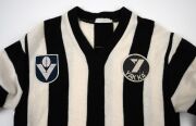 COLLINGWOOD: A late 1970s long-sleeved guernsey, VFL logo and "Yakka" patches on front, number 19 on back; John Wise, Laurie Sandilands, and Craig Davis wore this number during the seasons when this guernsey configuration was used. - 3