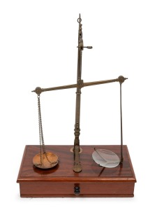 Antique gold scales on a single drawer mahogany base with ebony knob, 19th century, 37cm high, 25cm wide, 13cm deep.