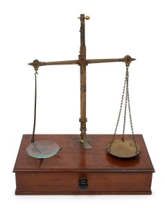 248 · Antique gold scales on single drawer mahogany base, 19th century, ​​​​​​​37cm high, 29cm wide, 15cm deep.