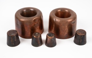 A pair of antique copper pudding moulds together with four assorted copper dariole moulds, 19th/20th century, (6 items), the largest 190cm high, 14.5cm diameter.