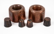A pair of antique copper pudding moulds together with four assorted copper dariole moulds, 19th/20th century, (6 items), the largest 190cm high, 14.5cm diameter.