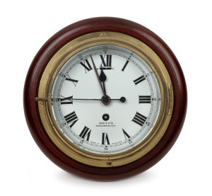SMITH'S vintage English maritime bulkhead clock timepiece in brass case mounted on timber board, 20th century, ​​​​​​​29cm diameter.