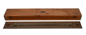 An antique maritime rolling rule in original mahogany case, 19th century, the case 64cm high.