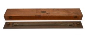 An antique maritime rolling rule in original mahogany case, 19th century, ​​​​​​​the case 64cm high.