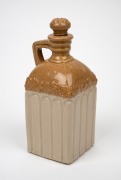 An antique English stoneware whisky decanter with original lid, circa 1870s, diamond registration mark to shoulder, stamped "S.W.", ​​​​​​​22cm high. - 2