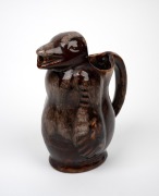 A brown glazed pottery bear wine jug, unknown age and origin, ​​​​​​​21.5cm high.