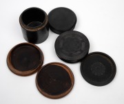 An antique lignum vitae box, together with two antique ebony boxes, 18th/19th century, ​​​​​​​the largest 8cm diameter. - 2