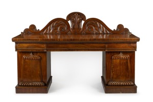 An antique Colonial Australian cedar twin pedestal sideboard with carved acanthus scrolling back with central plume and applied palladium panel doors with gadrooned decoration, Tasmanian origin, circa 1840, ​​​​​​​137cm high, 213cm wide, 73cm deep.