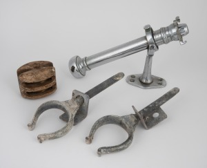 Maritime group including antique nickel plated spring loaded candle holder with gimbal mount, pair of vintage oar mounts and a timber pully, 19th/20th century, the largest 27cm high.