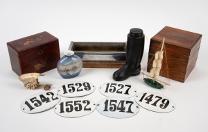 An antique Japanese lacquer ware box, a reproduction timber and brass box, a Danish porcelain vase, Wellington boot lolly jar, stainless steel and timber tray, assorted enamel number plaques, carved bone and malachite boat ornament, and a carved horn cart ornament, 19th and 20th century, (8 items), the largest 27cm wide.
