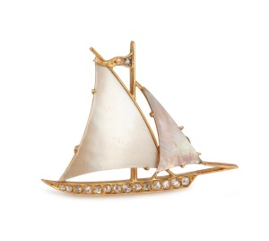 A vintage 18ct gold yachting brooch with mother of pearl sails and rose cut white diamonds, 20th century, 3.8cm wide, 4.8 grams.
