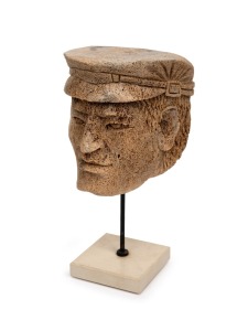 A vintage Japanese carved whale vertebrae sailor's head ornament, mounted on later stand, circa 1930s, ​​​​​​​29cm high overall.