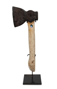 An antique iron hatchet with later Maori carved whalebone handle inlaid with paua shell, 19th century and later, ​​​​​​​37cm high.