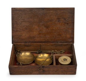 Antique gold scales in oak case with cup weights, 19th century, the case 20cm wide.