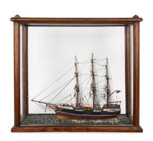 An antique model sailing ship in an Australian cedar case, 19th century, 55cm high, 62cm wide, 28cm deep.