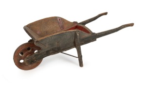A rare and early folk art homemade wheelbarrow crafted from eucalypt and pine with hand forged iron and remains of original painted finish, Barossa Valley, South Australian origin, circa 1860, unusually small size and very robustly made. 42cm high, 43cm wide, 118cm long.