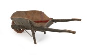 A rare and early folk art homemade wheelbarrow crafted from eucalypt and pine with hand forged iron and remains of original painted finish, Barossa Valley, South Australian origin, circa 1860, unusually small size and very robustly made. 42cm high, 43cm w - 2