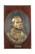 JOHN GOULD repousse brass oval portrait plaque mounted on timber board bearing engraved label "JOHN GOULD, THE BIRDMAN, Founder of THE GOULD LEAGUE OF BIRD LOVERS", 66 x 42cm overall.