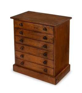 An antique Baltic pine seven drawer miniature chest, housing a notated collection of bird eggs, 19th/20th century, ​​​​​​​the chest 42cm high, 38cm wide, 23cm deep.