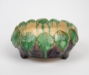 J. MITCHELL hand-built Australian pottery bowl with applied leaf decoration on purple ground, signed "J. Mitchell, Goodwood", 9cm high, 19cm wide.