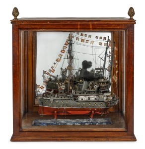 A vintage scratch built Spanish gun boat, housed in an antique timber and glass display case with pineapple finials, 19th and 20th century, 64cm high, 59cm wide, 35cm deep.