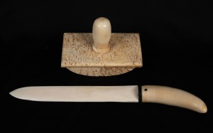 A whalebone and whale's tooth paper knife with baleen spacer; together with a whalebone blotter with whale's tooth handle, (2 items), ​​​​​​​the knife 27cm long.