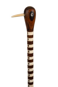 A vintage Australian walking stick with laminated native timber handle, inlaid with mother of pearl and marine ivory on a blackwood and stingray vertebrae shaft with baleen ferrule, 19th/20th century, 87cm high.