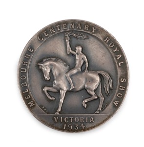 Melbourne Centenary Royal Show, 1934, award medal in silvered bronze (54mm) by Stokes, inscribed on reverse "Two Dorset Horn Lamb Rams / Second / T.S. Austin / 'Myuna' No131 of 34 & / Myuna No.201 of 34". Extremely fine.