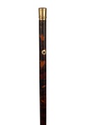 An antique tortoiseshell dandy walking stick with engraved gold cap and fittings, 19th century, 91.5cm high.