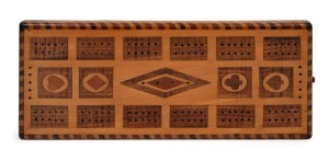 An antique Australian cribbage board, rare double-sided example in huon pine and fiddleback blackwood, 19th century, ​​​​​​​25cm long.