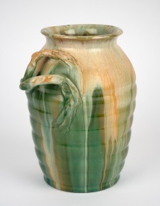 REMUED green glazed pottery vase with branch handle, incised "Remued 315/9", 24cm high.